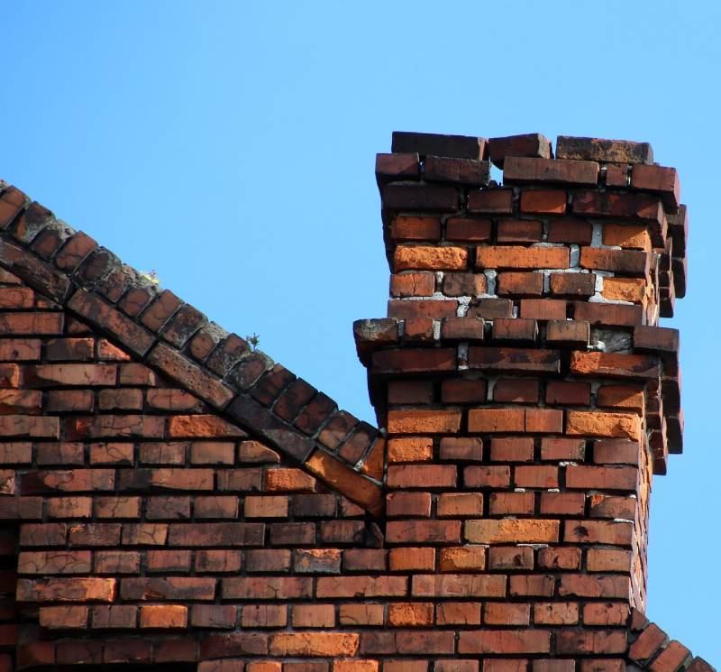 Signs Your Compton Home Needs a Chimney Inspection Damaged chimney on an Compton home showing cracks and missing mortar